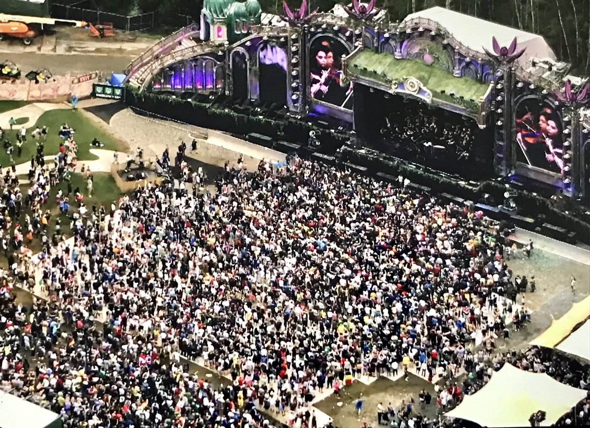 chrisbuijink's tweet photo. Celebrating 15 yrs of @tomorrowland + the #SymphonyofUnity by the @MetropoleOrkest academy & singers, conducted by Maestro Dirk Brossé #greatperformance #greatcrowd https://t.co/u93Kq8LMLV