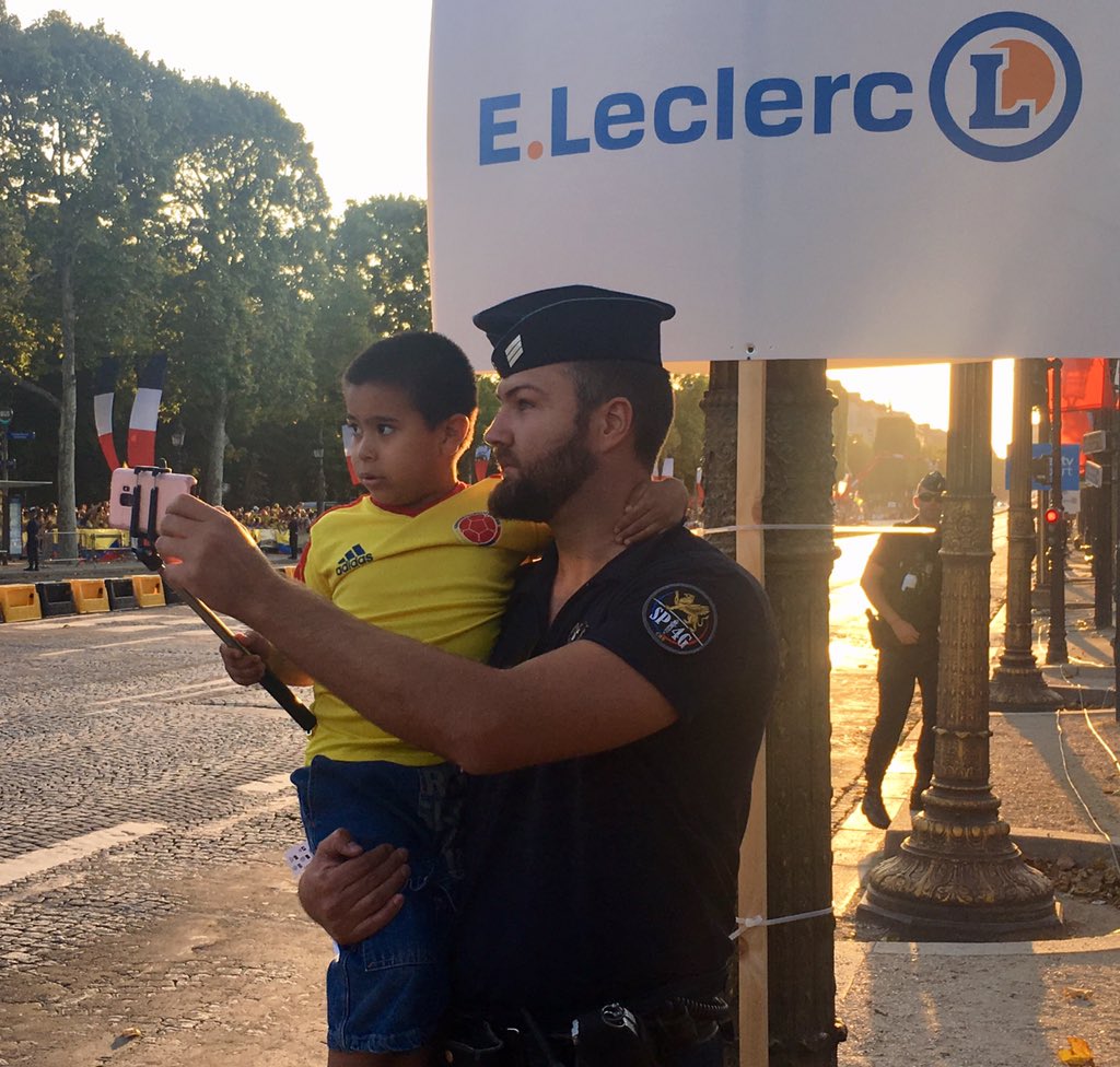 This is why I love international sports! A French policeman just lifted this Colombian boy from the crowd and carried him to the course so he could take a photo of Egan Bernal and the peloton passing. #tdf19