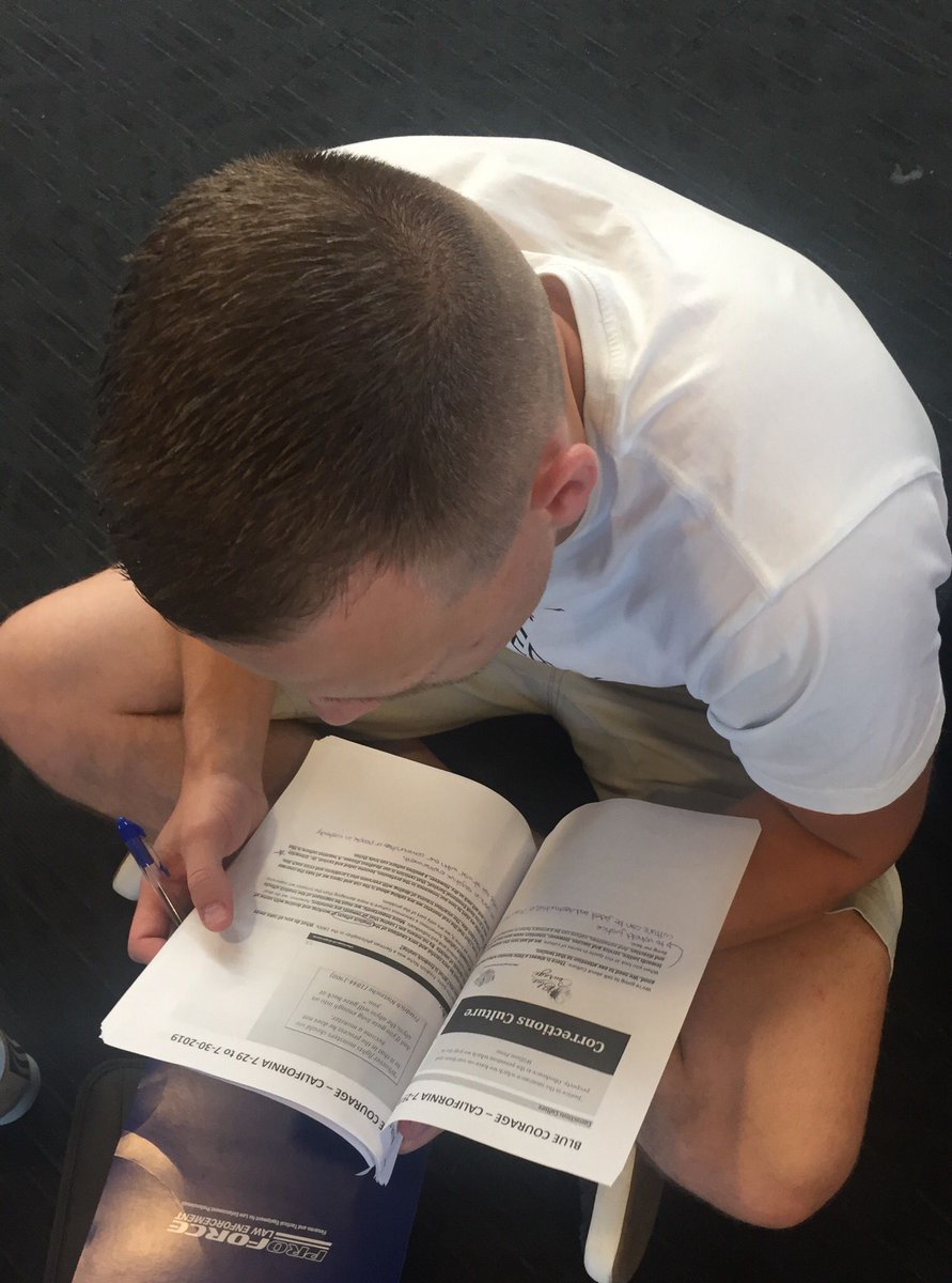 bluecourage's tweet photo. How one becomes a Blue Courage Master Trainer - "deliberate study!" Brandon preparing for tomorrow’s Blue Courage class at California Department of Corrections and Rehabilitation that he is teaching along with Michael and Ian. #bluecourage #roadtomastery #CDCR #corrections #CPOST https://t.co/JZKcmgJXkd