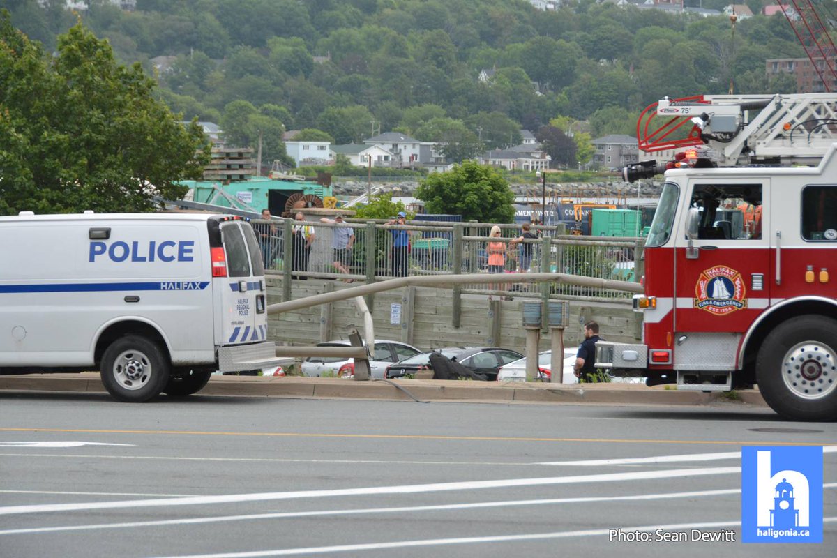 hfxtraffic's tweet photo. A single vehicle accident sent a vehicle through a guardrail into a parked car below near Kings Wharf. Emergency crews are on scene and traffic away from downtown is partially booked in the area #hfxtraffic https://t.co/tZOhjTxW88