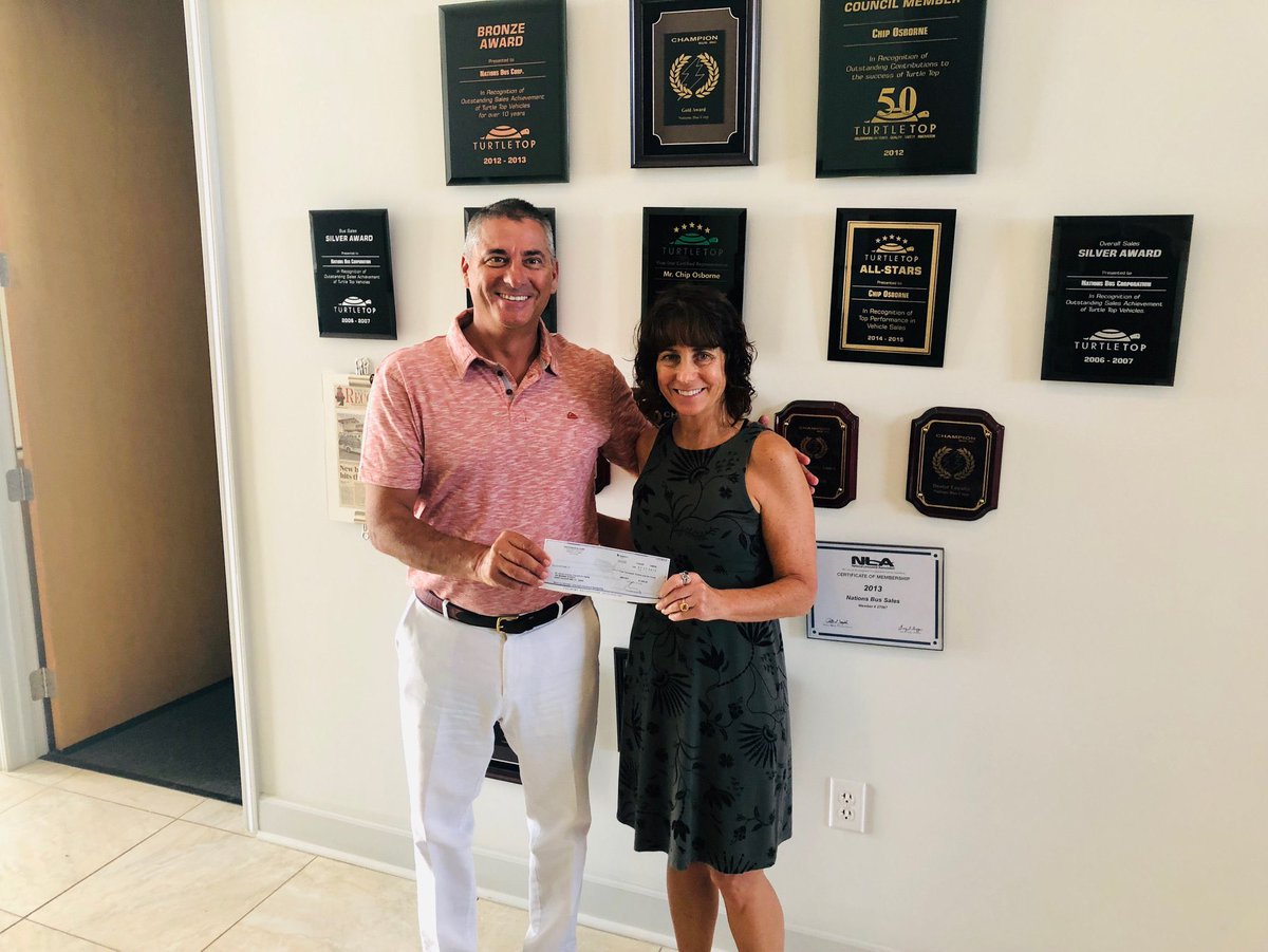 NationsBus's tweet photo. Council On Aging Director Becky Yanni receives a donation from Nations Bus' Chip Osborne. The COA and Nations Bus have a long-standing community partnership solving transportation needs for our elderly. #nationsbus #transportation #shuttlebus https://t.co/cJU8VBJrdr