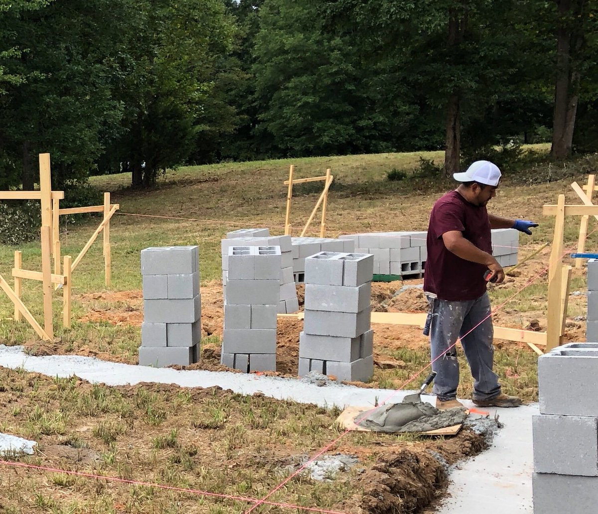SSSVPInc's tweet photo. Day 5 Phase II - Concrete block foundation- ALL corners are up both houses!! Thank you Hugo !! #onehomeoneveteranatatime #believeinthemission #choosetoserve #sssvp https://t.co/18h83VyxV9