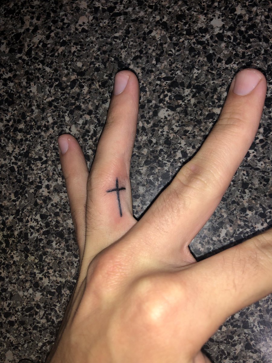 Cross Tattoo on Ring Finger: Meaning & Style
