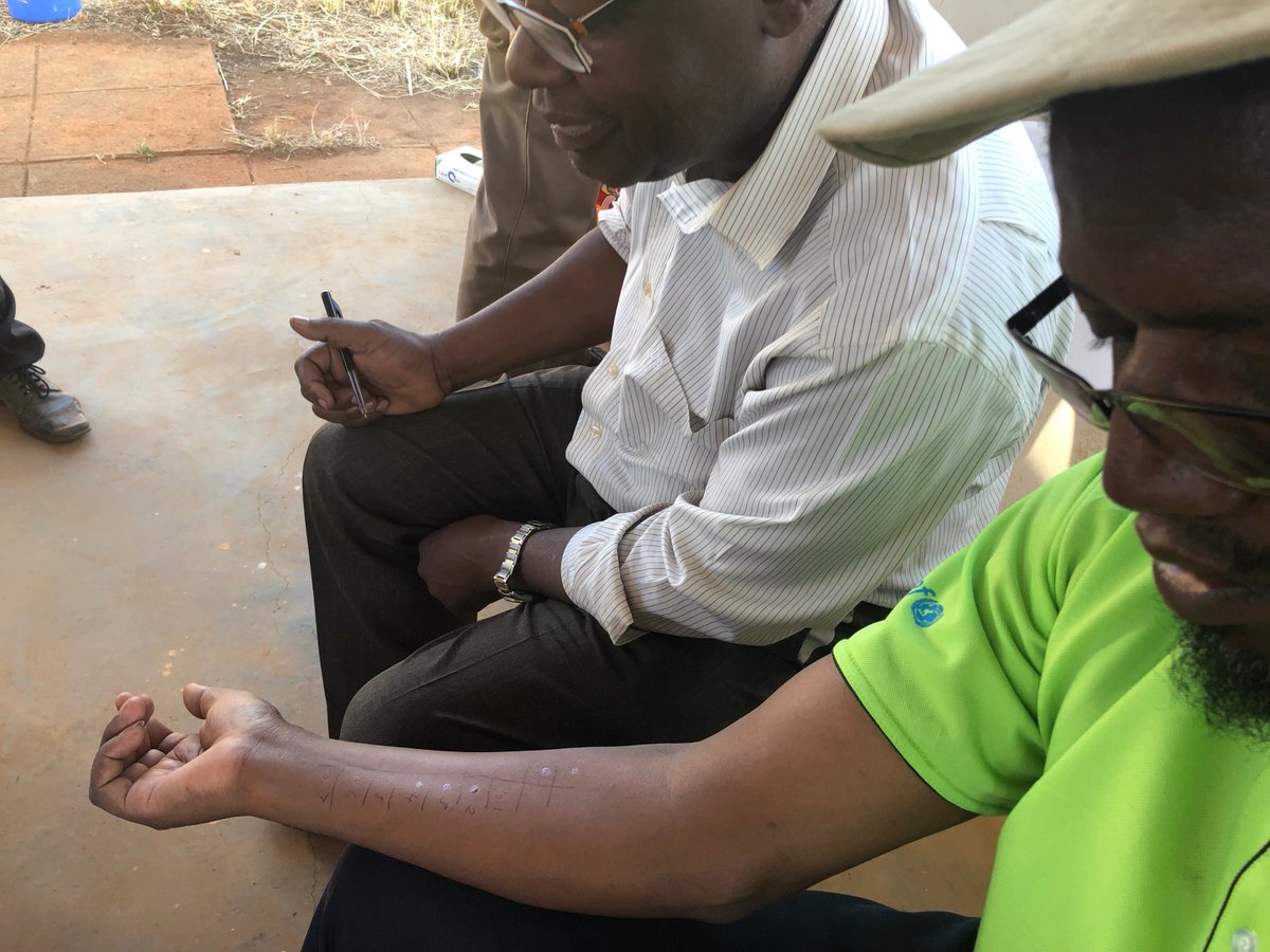 PIG_Edinburgh's tweet photo. @ProfTaka &amp; @elopy_sibanda demonstrating the #SPT  to participating children &amp; parents/guardians in Shamva, Zim as part of our current mycobiome/allergy @oakfnd @NDMOxford @SBSatEd @EdinburghUni studies https://t.co/Stj2SUNBeo