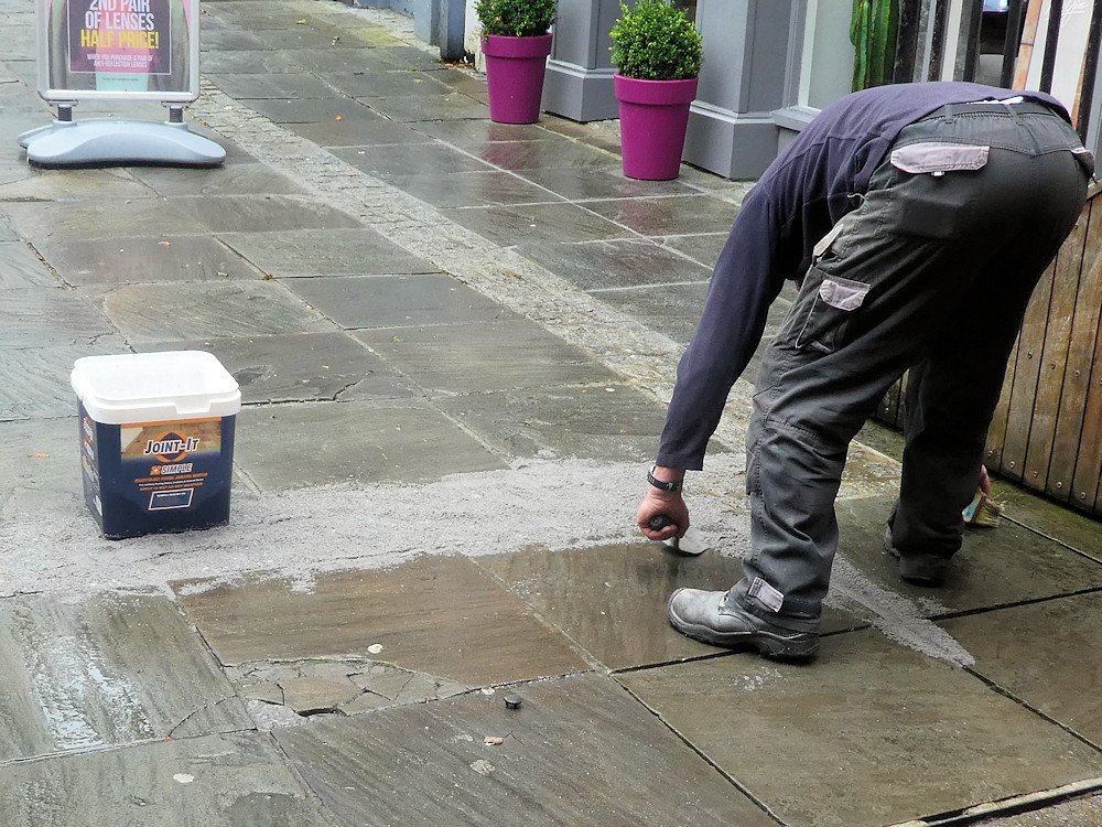 pavingexpert's tweet photo. ...and the very next day, walking through Westport to get a bite with the gorgeous @KathyMMuldoon , what do we stumble across, but Joint-It in action, being used to repair some pretty ropey paving. I'd suspect the Joint-It will outlast the awful paving! #headdownarseup https://t.co/WYtOOZaQqY