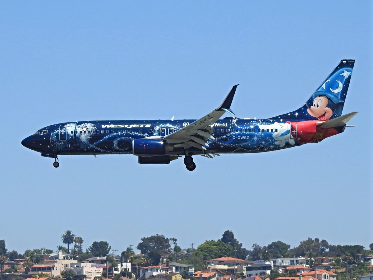 CGWSZ, Disney World Mickey Mouse special livery, Boeing 737-8CT operating as WestJet WS1564 landing KSAN runway 27 on 14 August 2019. #avgeek #planespotting