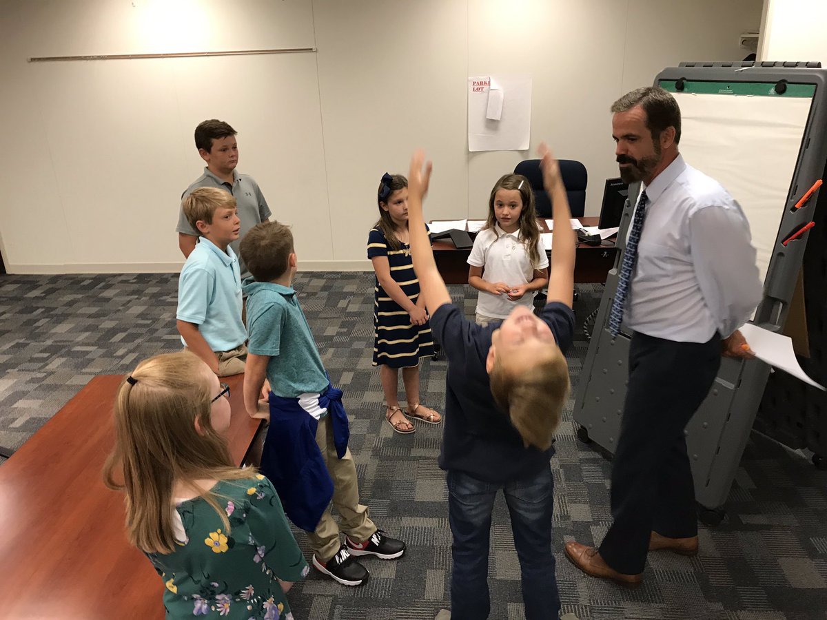 OH_OBM_Director's tweet image. Today is #NationalFinancialAwarenessDay but @Ohio_OBM started celebrating early. Here’s our own debt management guru teaching middle schoolers all about interest rates during Take Our Children To Work Day! #Math #BudgetFun