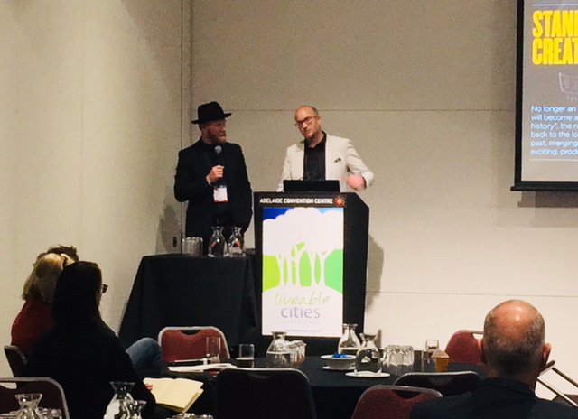 SustainAssoc's tweet photo. Matt Barratt and Andrew Hoyne are presenting about placemaking for economic success - real world examples. #Liveable19 #liveability #economic https://t.co/RZ1Jxgmb0v