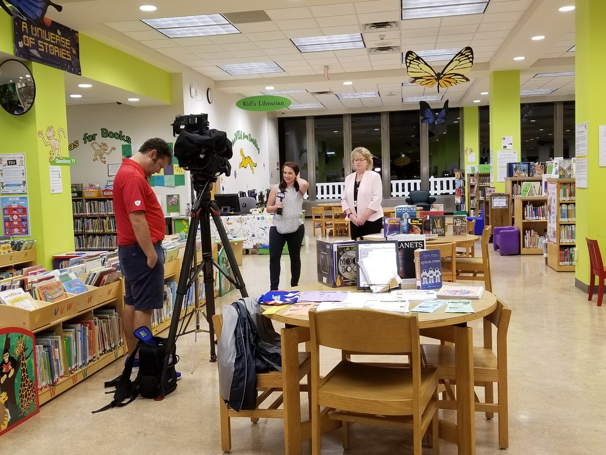 buffalolibrary's tweet photo. @SPECNewsBuffalo @BreannaFuss is live this a.m. from the Library's Reading Park, hoping the rain will stop by 12 noon for our daylong free celebration. Join us! Music, crafts, @ReadingInvasion, food trucks $, and more! Open till 7pm. https://t.co/KgqwdHKsYB