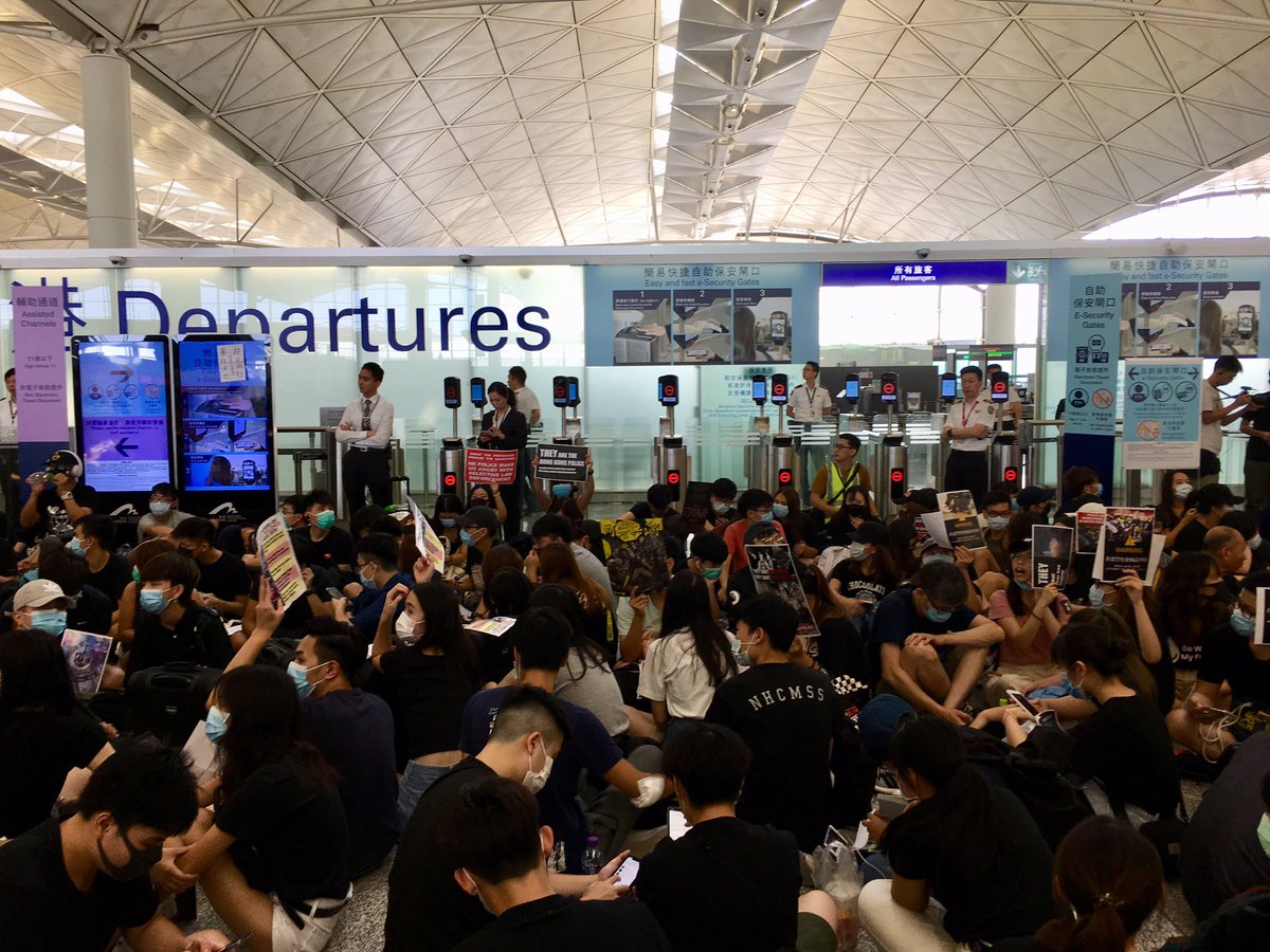 RolandLimCNA's tweet photo. #HappeningNow @hkairport announces serious disruption has affected services. No more check-ins for flights today. #antiELAB protestors get their way for the second day in a row. https://t.co/Wk8smbPId0