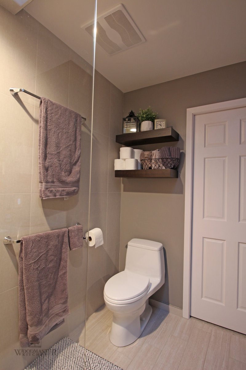 WoodmasterMI's tweet photo. Clever #bathroomdesign is all about combining an effective layout and the right products. The @TOTOUSA toilet fits neatly under dramatic wood floating shelves in this #WashingtonMI #bathroomremodel. https://t.co/sKLkAdPvLz