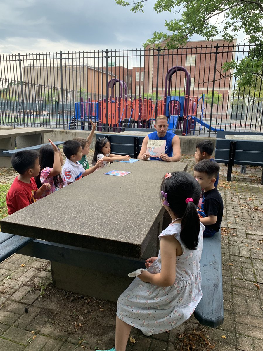 NWBAYSIDECIVIC's tweet photo. I hope @PS159_Q doesn’t mind that I do the tweeting today of the read aloud in the garden. Thank you to @Pollak159 for his rendition of @MoWillems @The_Pigeon Finds a Hot Dog. We were all engaged and amused!  Even rain cannot stop reading! https://t.co/ccLUkn2V1E