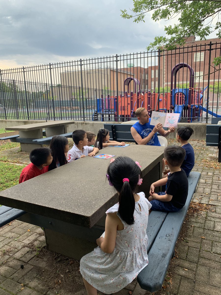 NWBAYSIDECIVIC's tweet photo. I hope @PS159_Q doesn’t mind that I do the tweeting today of the read aloud in the garden. Thank you to @Pollak159 for his rendition of @MoWillems @The_Pigeon Finds a Hot Dog. We were all engaged and amused!  Even rain cannot stop reading! https://t.co/ccLUkn2V1E
