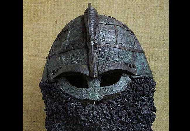 I think Thorsberg can be tied to the development of the Valsgarde 8/Vendel 14 Skeletal helmets (Late 6th and Early 6th Century, respectively) from its style. The central ridge and base ring also suggests a tie to the Benty Grange helmet.