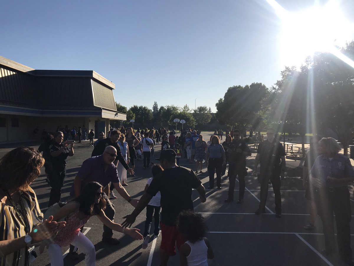 PacificBaseball's tweet photo. Some Pacific ball players welcoming students back for 1st day of school at Claudia Landeen Elementary! #UpRoar https://t.co/7dATaesCCm