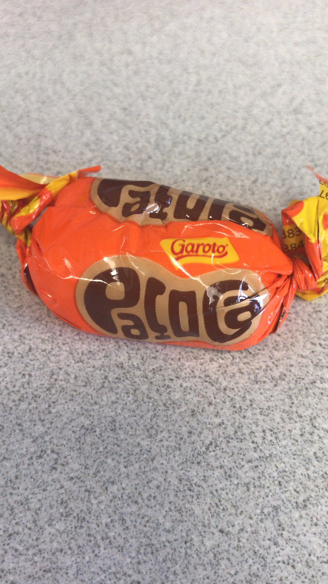 katieschro8's tweet photo. Perks of having an advisor that frequently works in Brazil: a constant flow of exotic candies! I don’t know what this says, but I’m about to eat it. Maybe it gives secret manuscript-writing powers. #Dreams #PodosLab https://t.co/onxfvhQsIq