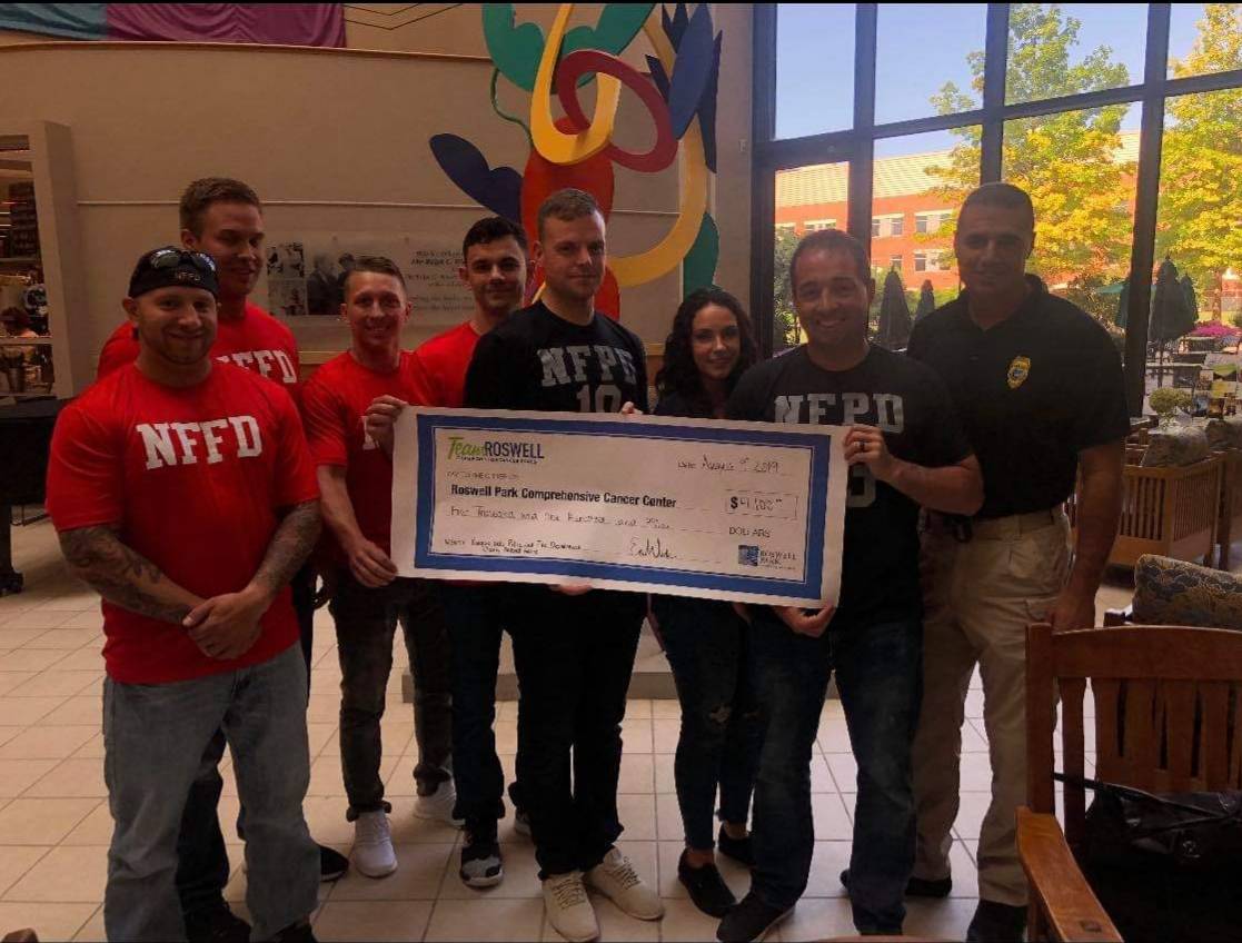 NiagaraAction's tweet photo. Members from the Niagara Falls Police and Fire Departments presented a check for $4100 to Roswell Park Cancer Institute. 

The money was raised during their annual PD vs FD flag football game. 

This is just one of many charity and community events hosted by both departments. https://t.co/XbKEHKcXhB