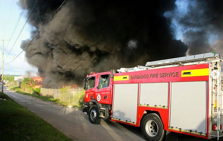 FireControl246's tweet photo. Crews from several stations have been mobilised to the fire B's Recycling, Cane Garden, St Thomas. Our crews are working expeditiously in collaboration with other relevant agencies to contain the blaze. (Images: Barbados Today) #Barbados #FireControl #FireDispatch https://t.co/1Pgorki4RD