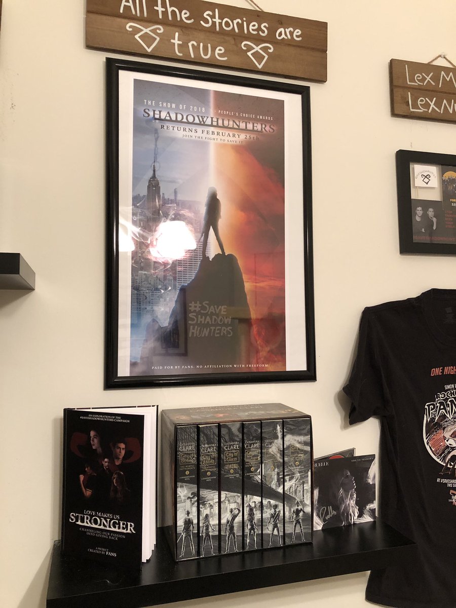 VVitch8's tweet photo. Y’all! I’m super excited to share my #Shadowhunters collection display I just put up in my office. It’s a mix of my love for the book series &amp; show!

Thank you so much to
@IconicNephilim 
@MalecFicLibrary 
@ShadowMerch 
@AlexandersStele 

#Saveshadowhunters 
#ShadowhuntersLegacy https://t.co/ybzrYrMSlQ