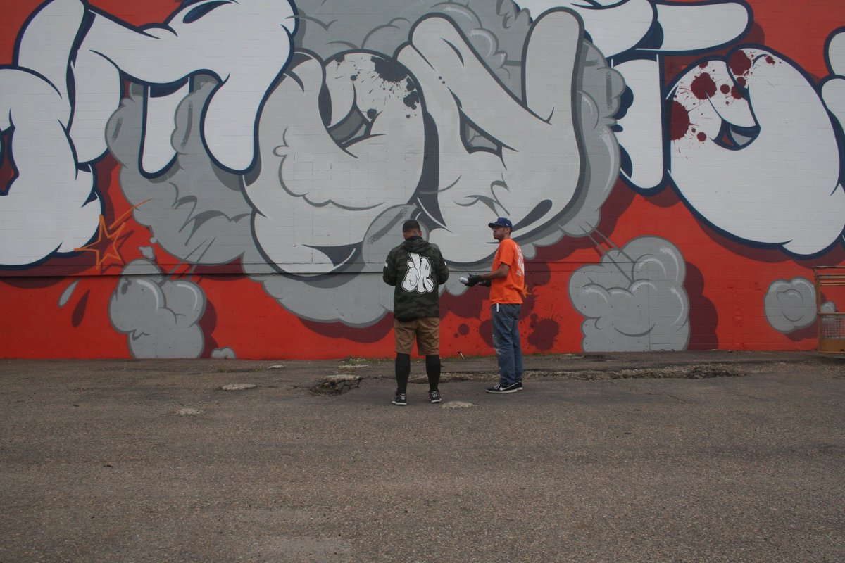 MinusIndustries's tweet photo. Here's @SLICK_DISSIZIT putting the finishing touches on his incredible piece. #SLICK & his assistant Luke put in long hours on #theEtowngetdown mural for #RUSTMAGIC. I can't wait to see all the selfies in front of this beast. #RUSTMAGIC2019 #YEG #YEGDT #YEGART #YEGARTS #YEGSA https://t.co/pe2yl1plrL