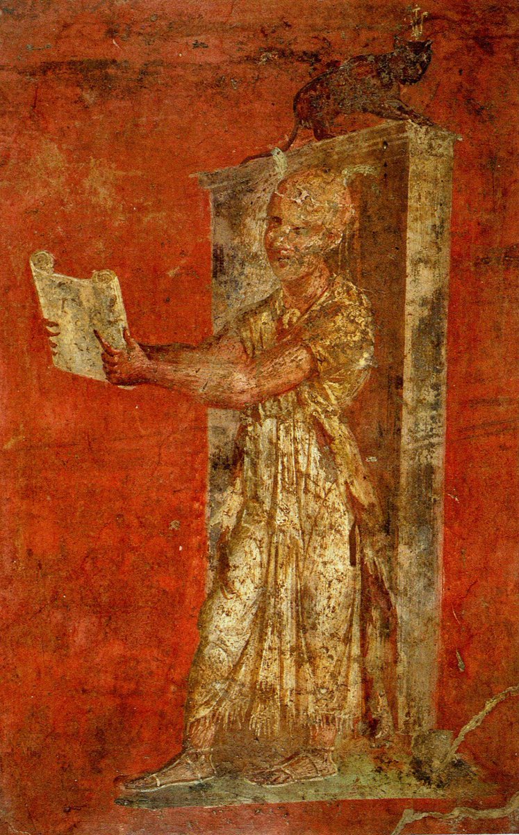 antinousgaygod's tweet photo. This #Pompeii #Fresco shows a #farsighted #Isis #Temple #hierogrammateus (sacred #scribe) studying a #papyrus. #Antinous especially likes the black #cat wearing a stylized #Egyptian #SWTY 2-feathers #crown. The #Priest also wears a #diadem with 2 white feathers on his bald pate. https://t.co/W97OvJtO2E