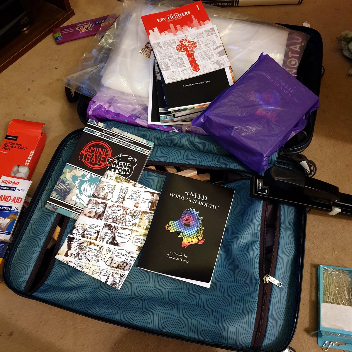 ThomasTung's tweet photo. Getting all packed for @HomecookedFest this Sunday! Featuring the debut of #ThatsNOTHelpful, new #HorseGunMouth and of course #TheKeyFighters and @MiniTomComic! Who am I going to see there?! https://t.co/GlJo7y6h6I