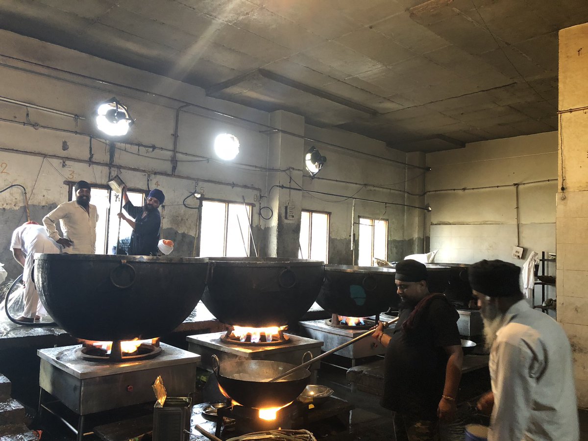 The mega-kitchen with mega-bartans at the Golden Temple, Amritsar. Running 24/7 & feeding up to 100,000 people a day. Image 2 is of water put to boil for chai. A hall full of roti makers make 200,000 rotis a day on an average. Amazingly, this is 90% volunteer (Sevadaar) run.