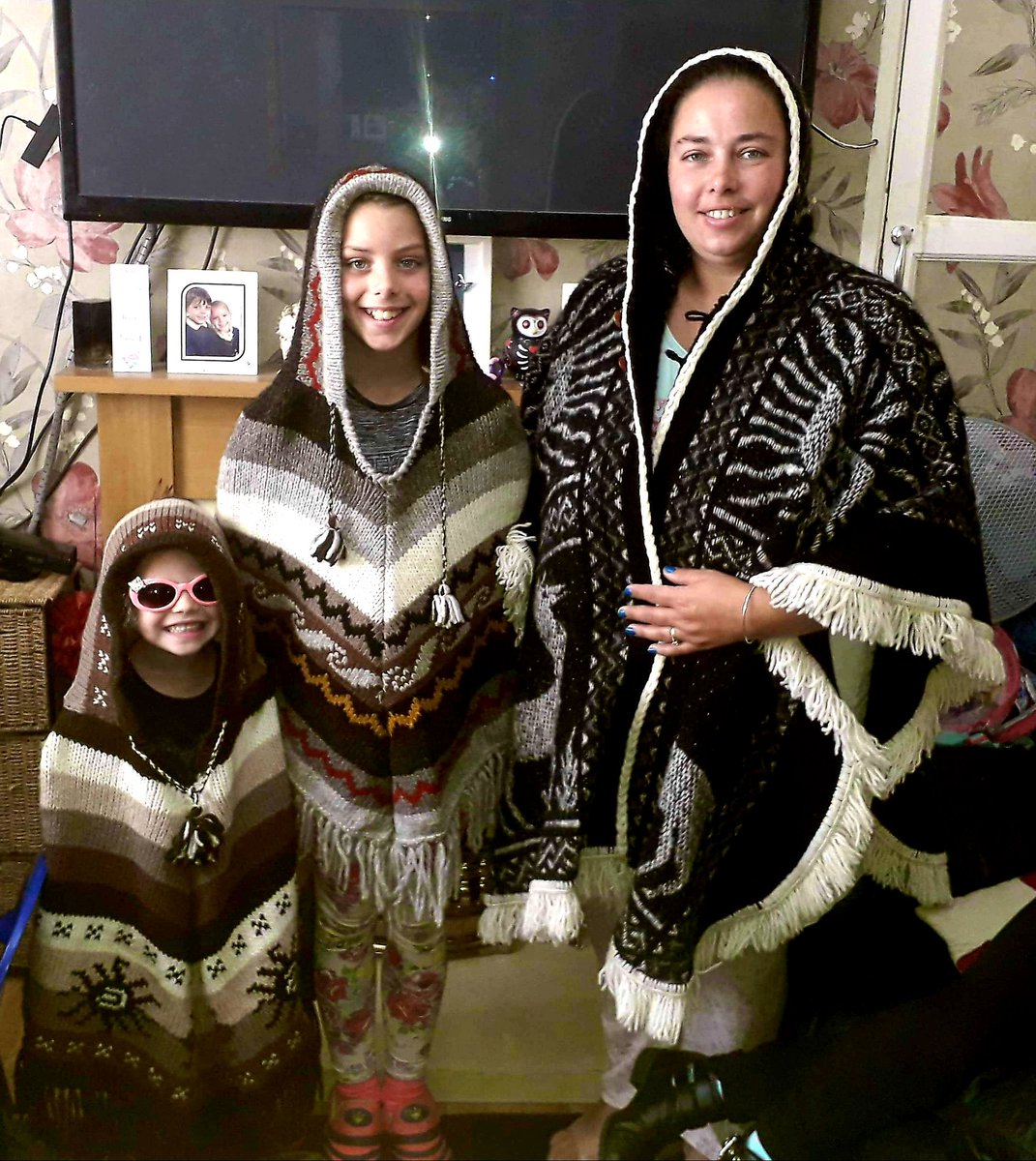 Meridithia's tweet image. Our ponchos I bought from a stall at rock the park