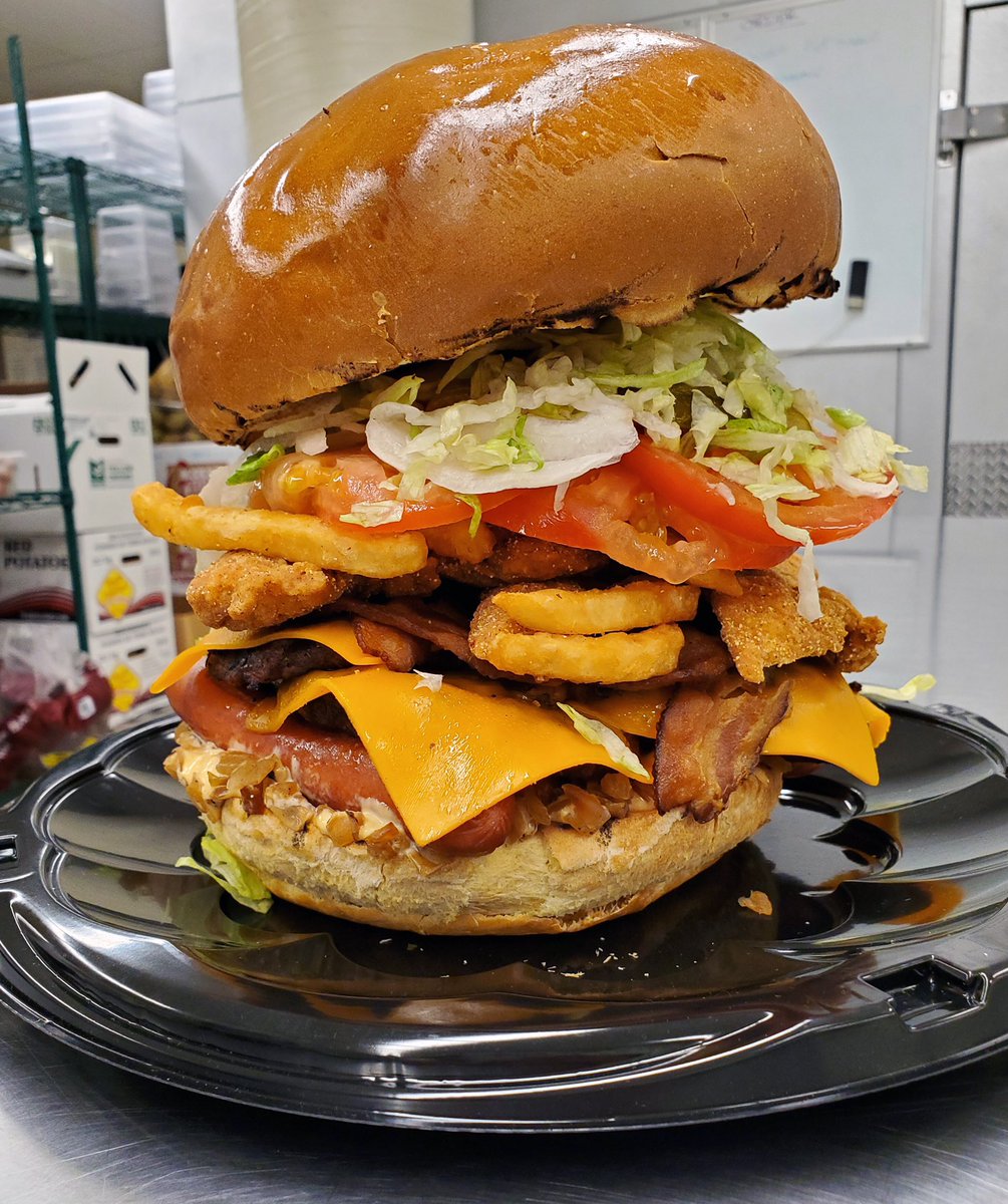 Wpg_BlueBombers's tweet photo. *ahem* 

Introducing the Walby Burger!

- six burger patties
- six chicken tenders
- six hotdogs
- six pieces of bacon 
- cheese 
- pickles 
- lettuce 
- fries 
- onions
- tomatoes
- secret special sauce. https://t.co/plDrpqf9EW