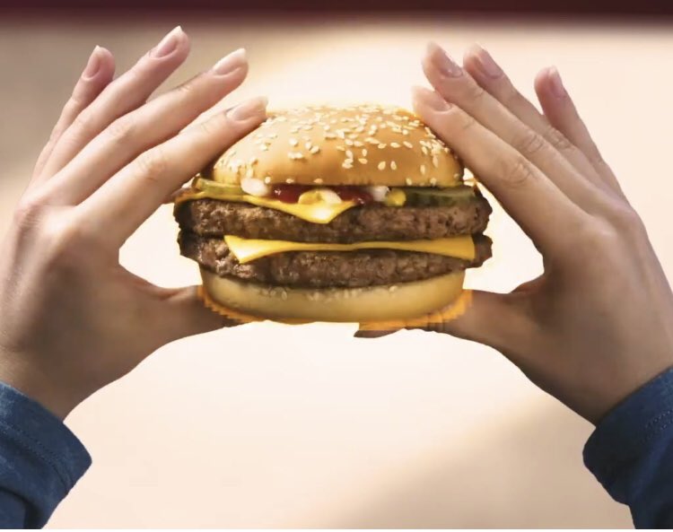 The way people hold burgers on burger ads is how I imagine undercover guards hold burgers at festivals