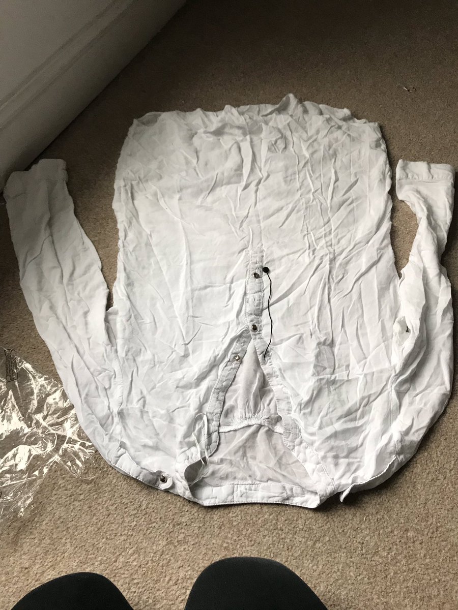 Danniepow's tweet photo. omg 
I’ve Just picked up my parcel from @nextofficial 
opened it &amp; thought the play suit looks dirty white, so I might have to send that back
TURNS OUT ITS NOT A PLAYSUIT ITS A PRIMARK SHIRT 🤦🏼‍♀️
Someone’s obvs had the item before then swapped it for one of their own! Scruffy gets! https://t.co/3KAkvqt78w