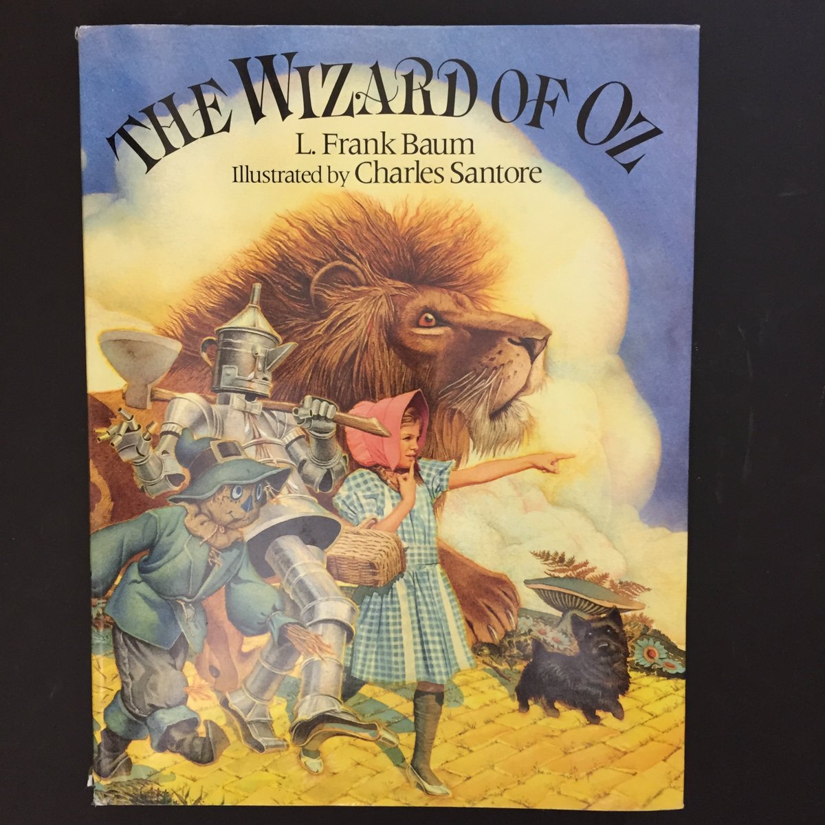 One of my early influences, Charles Santore has passed away. Today I wanted to focus on a book that I poured over so often I had to buy a second copy. Santore’s THE WIZARD OF OZ is a picture story book which means the illustrator has to allow for much more text than a picturbook.