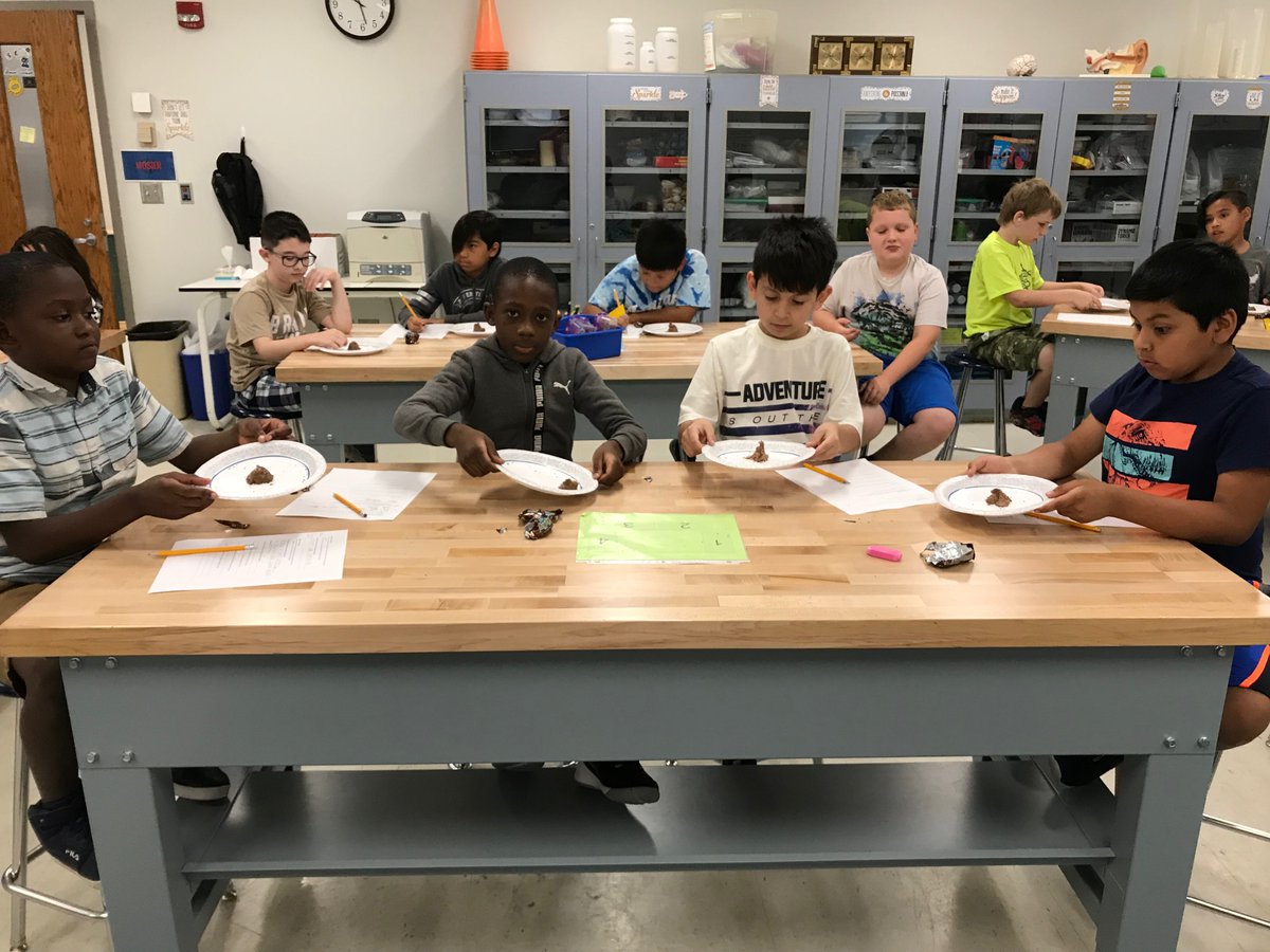 Fourth Graders investigated Volcanoes, Landslides and Earthquakes using Milky Way candy bars, sprinkles and a plate. Students were able to make the connection between the movement of the plate that held the candy bar and the tectonic plates which move during earth quakes. #ic1920