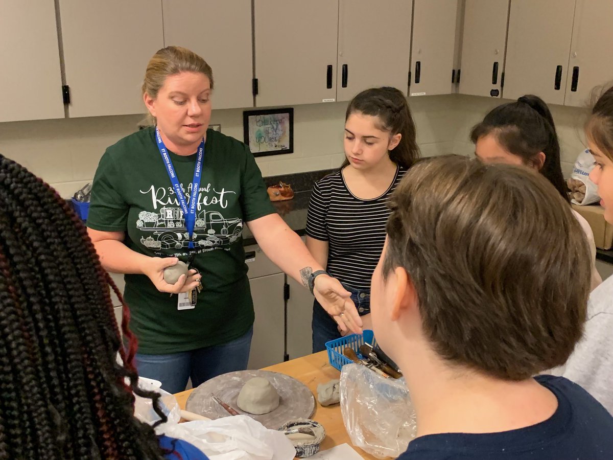 Ginger_K_Morgan's tweet image. ⁦@ETBoothMS⁩ with our Art teacher, Ms. Jones. She is “modeling” how to create a three dimensional clay figure from a sketch. #exploringart