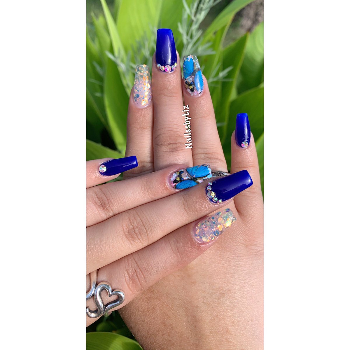 _LVGlam_'s tweet photo. Part 1: Life is to short to have naked nails 🥴💙 #sanails #nails #sanantonio #nailtech #sanailtech #nails #acrylic #glitter #art #stones #blue #bold #sparkly #butterflies https://t.co/V8c4YKrpNp