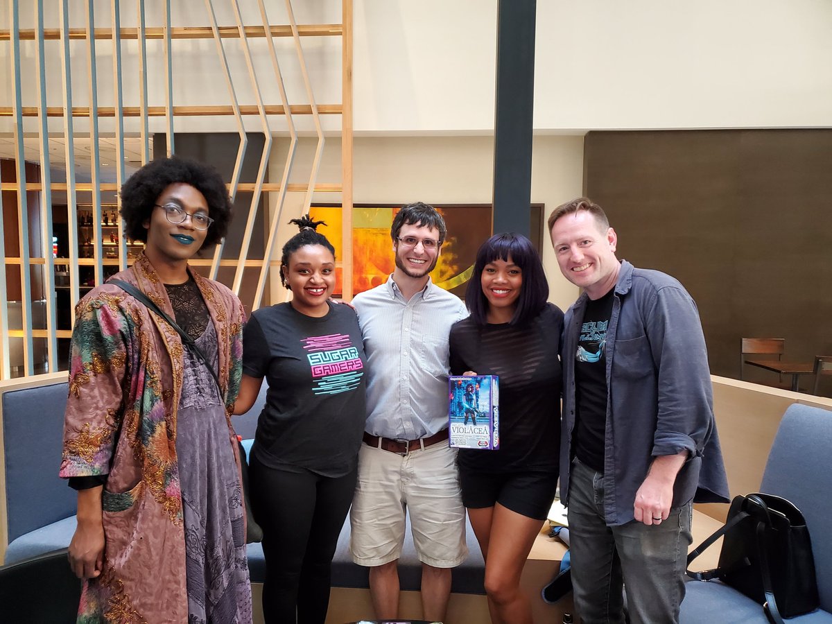 SugarGamers's tweet photo. Having fun and making friends at @Gen_Con with @SeanNittner @colinkyle57 @AlwaysBeZen showing our game #projectviolacea a #sugargamers and #wrongbrothers collaboration! Also it was a pleasure to meet super talented illustrator Jabari Weathers! 💗 #GenCon #Gencon2019 https://t.co/GbkE1wi3X2