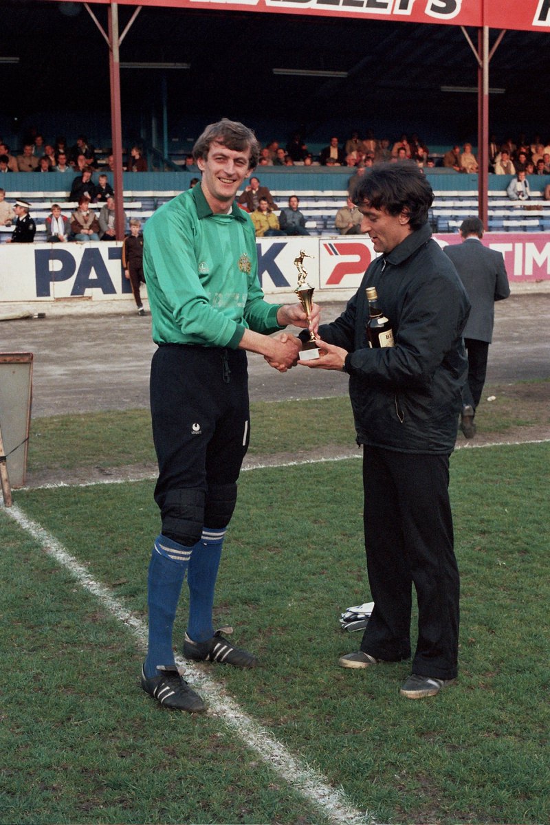 Paddy Roche. Halifax Town player of the year 1985. Swindon manager Lou Macari, a former team-mate at Manchester Utd, presents the trophy. Photo by Keith Middleton. Please remember to credit him if using the image.