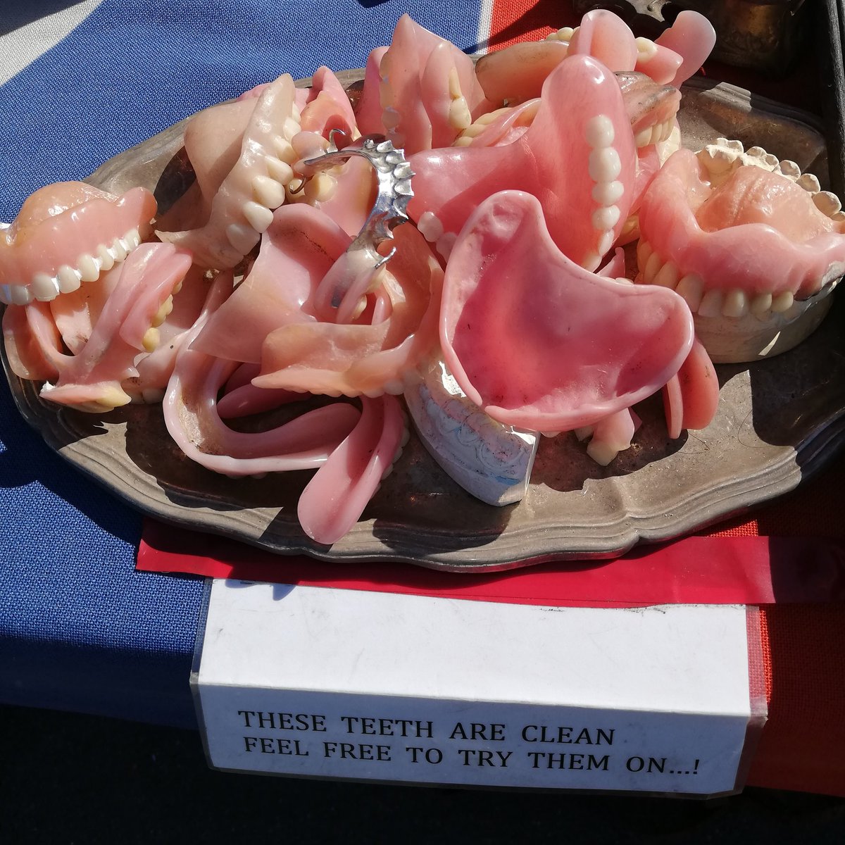 rylandfisher's tweet photo. Seen at the Milnerton market this morning,. 'These teeth are clean. Feel free to try them on.' #whyilovecapetown #whyilovesa #nofancycamera #capetown #milnerton https://t.co/S3lWqC5CdK