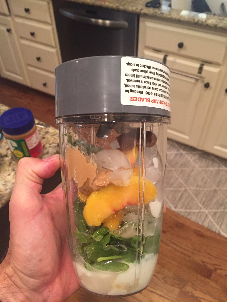 6 oz coconut water, spinach, banana,   handful frozen peaches, 2 tablespoons plain yogurt, 1 tablespoon almond butter, one date, and ice. Blend.