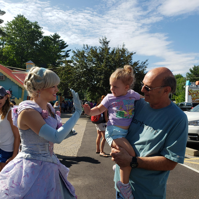 StoryLandNH's tweet photo. Where else can you start your day with a high five from #Cinderella? 👑✨ https://t.co/QqzoW3h2XG #WhereFantasyLives #StoryLandNH #LiveFreeNH https://t.co/VEk9L1sJDp