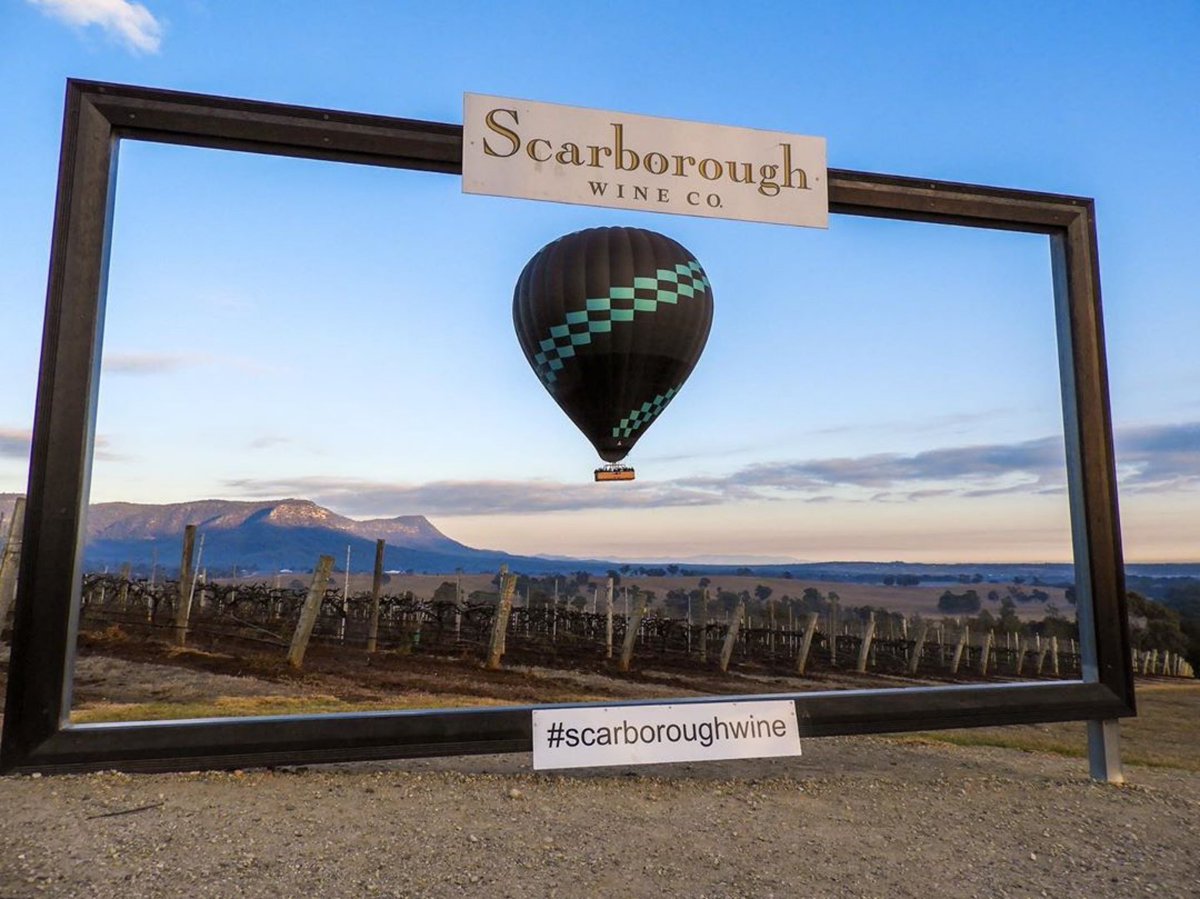 huntervalleywc's tweet photo. When #beyondballooning photobombs the insta frame at @scarboroughwine. Here’s to the good life in the Hunter Valley! #seeaustralia #newsouthwales https://t.co/zpahAW7txg