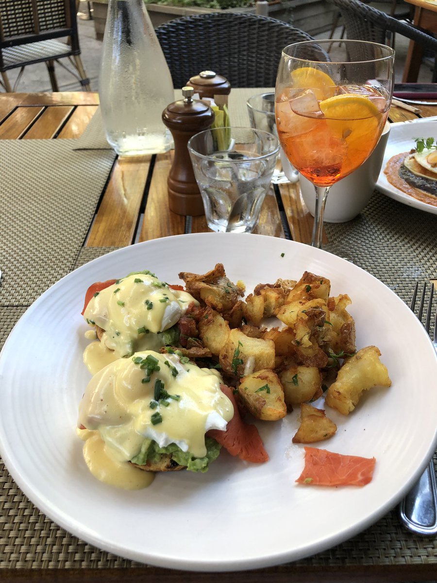 Enjoying a breakfast “avocado toast Benedict” in the farm to fork capital.  The aperol spritz completes it.