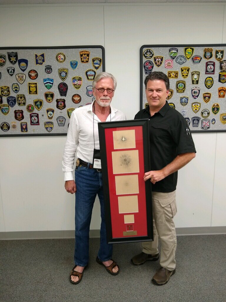 MU_Forensics's tweet photo. Prof. Dave Pauly with @GrahamHetrick at the #writerspoliceacademy #murdercon. Prof. Pauly presented Mr. Hetrick with a gunshot display. https://t.co/QlurA7KVOs