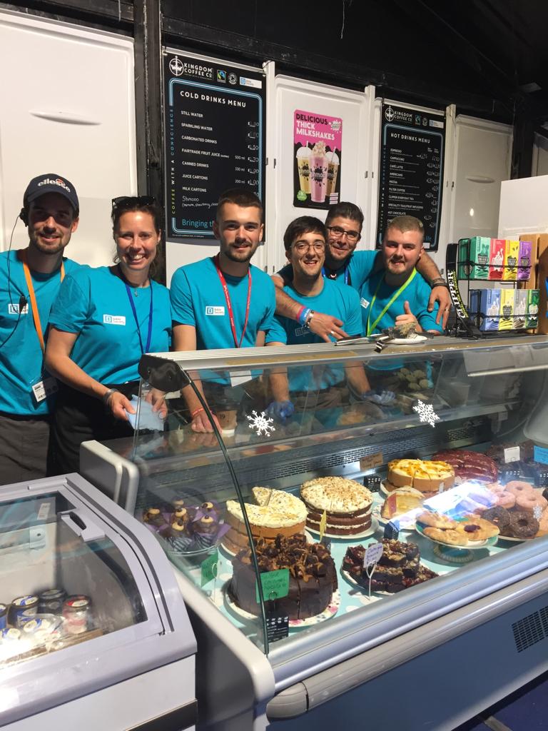 biblesociety's tweet photo. Volunteers and Cake... Can't do without either of them! 🥰🤩😁 #NewWine Week 2! @NewWineEngland https://t.co/PbeQOp0Drm