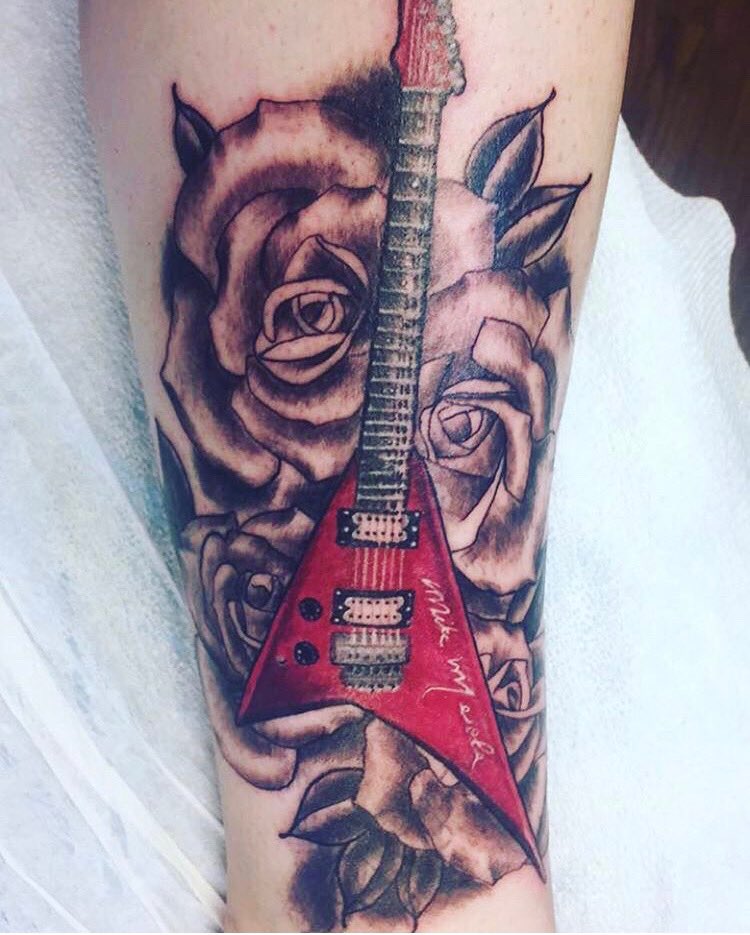 My daughters tattoo of my Guitar !!
