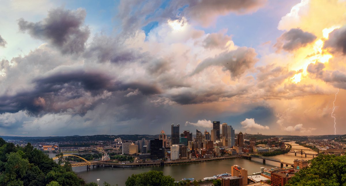 DaveDiCello's tweet photo. A panorama I never shared from an insane summer storm over #Pittsburgh. As I was capturing the images, trying to do the incredible clouds and light justice, a lightning bolt hit during my last frame. Crazy to see the sunlight illuminating the clouds on the far side of the city. https://t.co/mtk8TubXA1