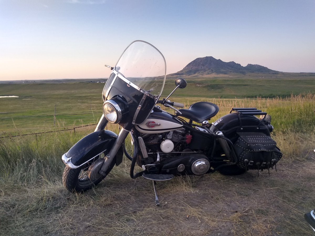 tx2sturgis's tweet photo. Classic Panhead with Bear Butte in the distance. https://t.co/bKu1INnPQr