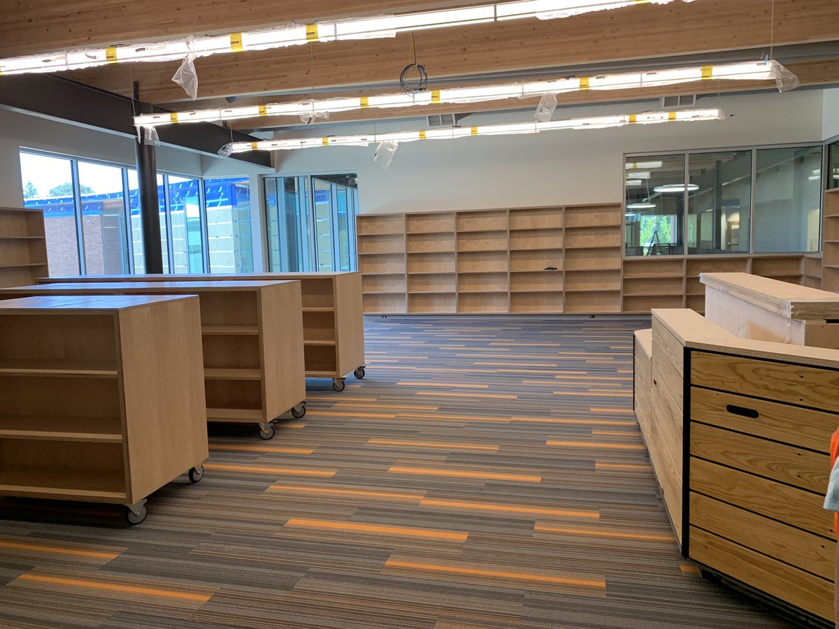 VPMayStreet's tweet photo. Day 1- old gym bleachers decorate the new library desk. Just waiting for books and kids! #VPdayinthelife https://t.co/8PQZ2WiKli