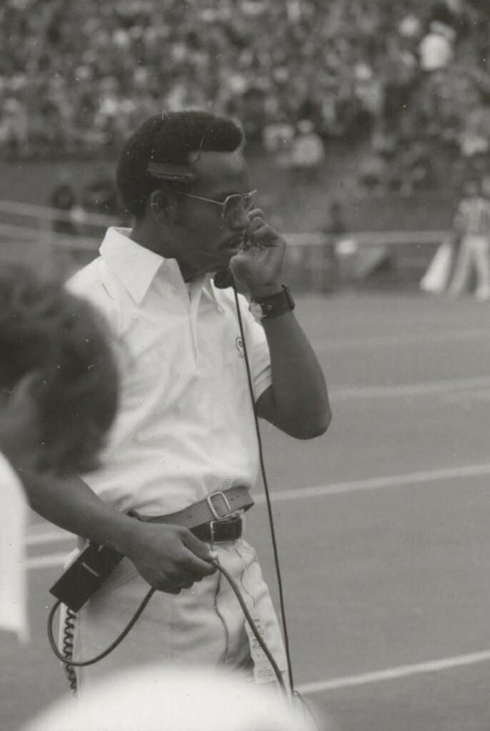 Jim Martin '76 on the football field at Camp Randall