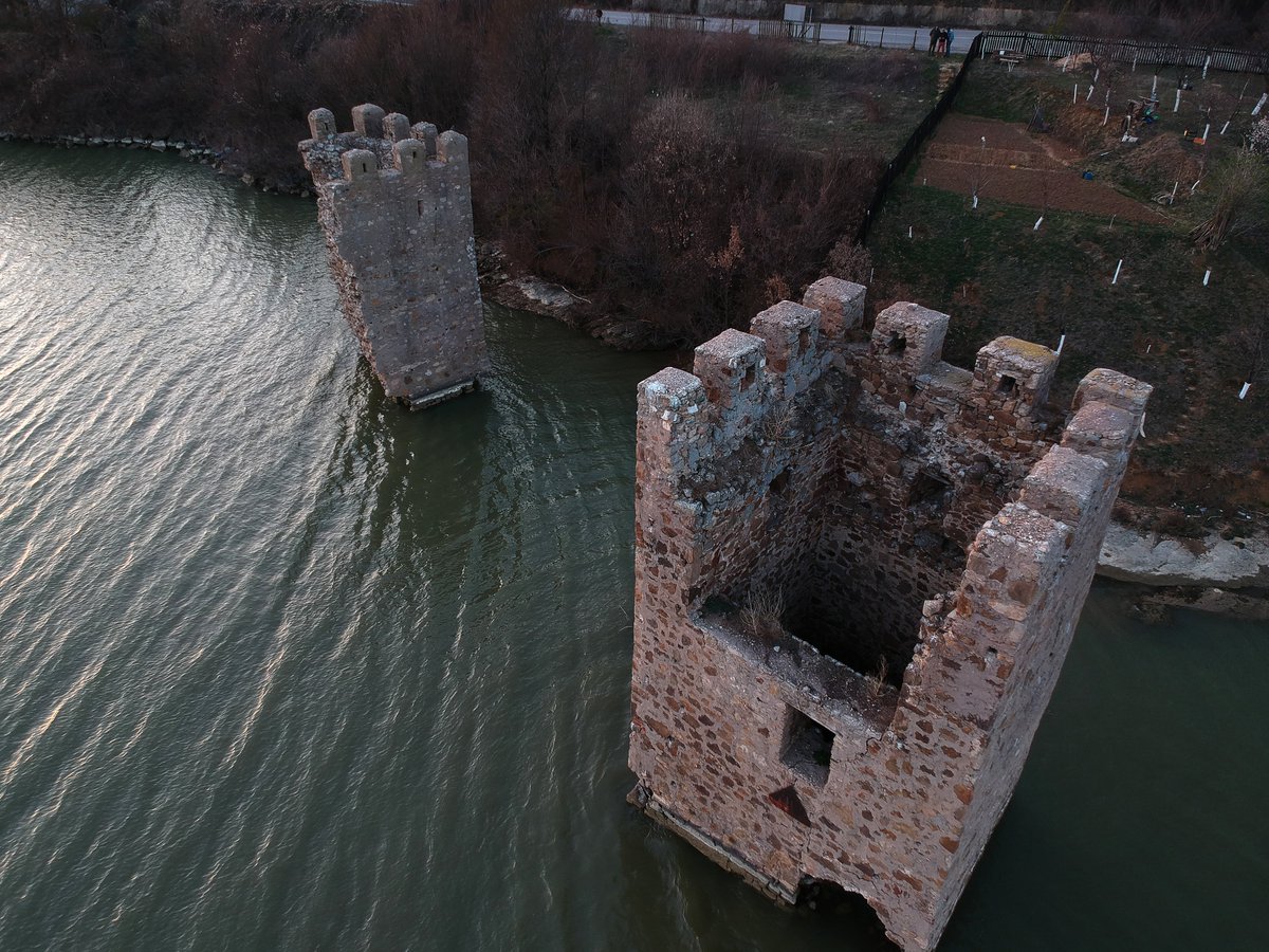 Cetatea Tricule, or the Tricule Fortress, a medieval structure right at the Danube riverside in Romania, was built sometimes between the 13. century and the 15. century and it got partially submerged during the build of the Iron Gate I Hydroelectric Power Station.